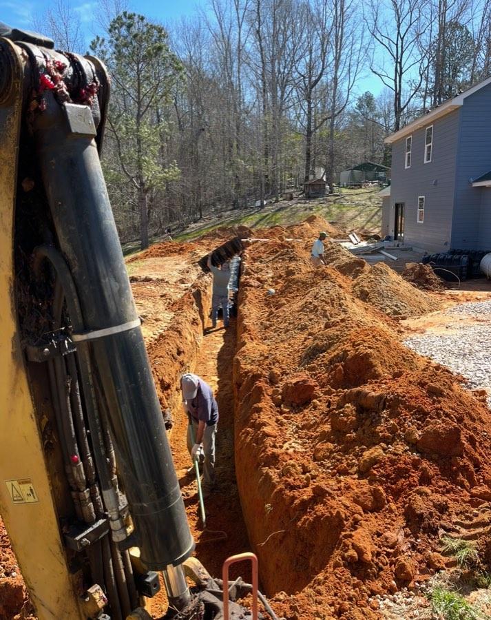 Long trench beside a home